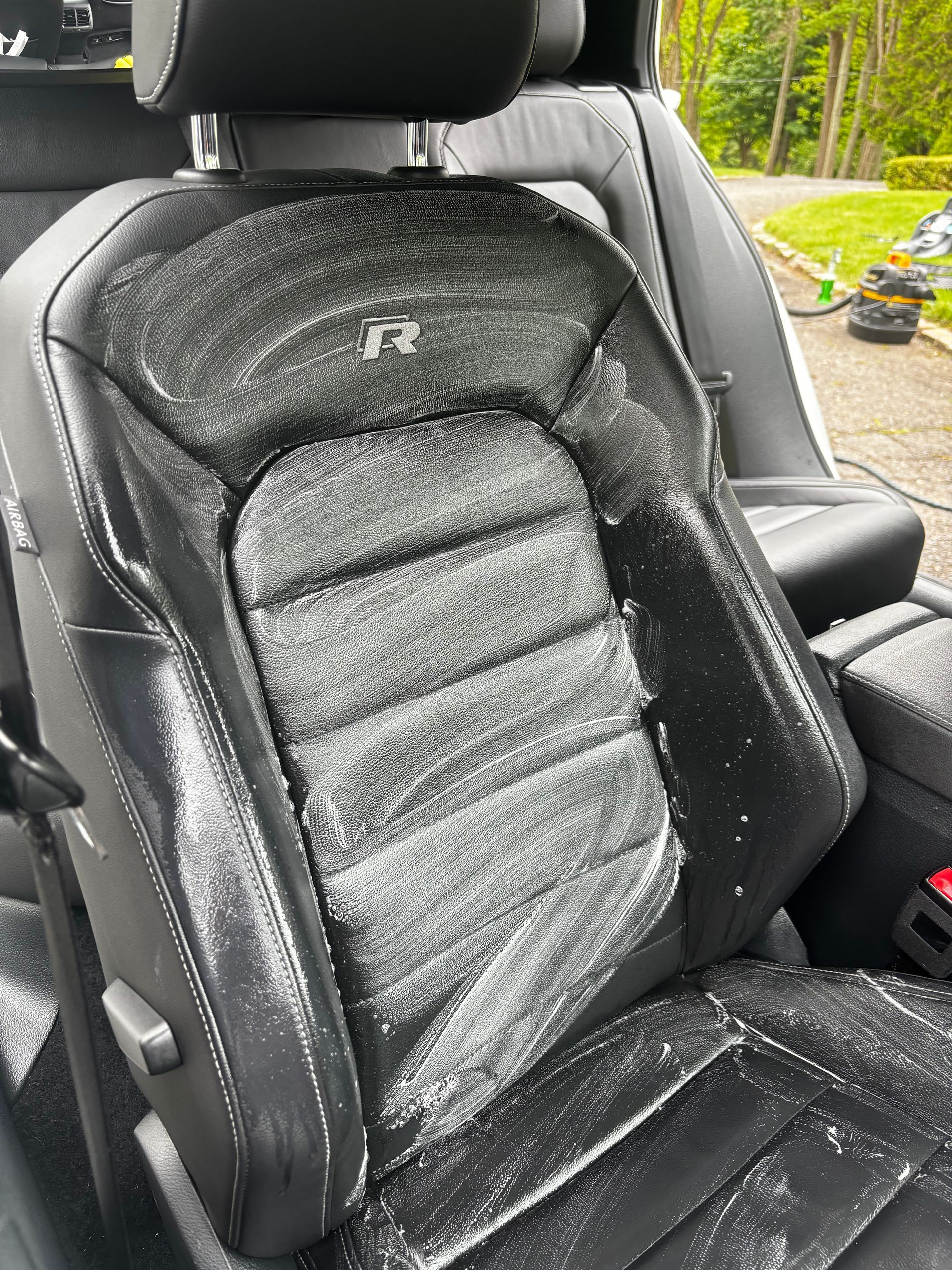 Detailed leather seat interior showing premium conditioning and deep clean finish