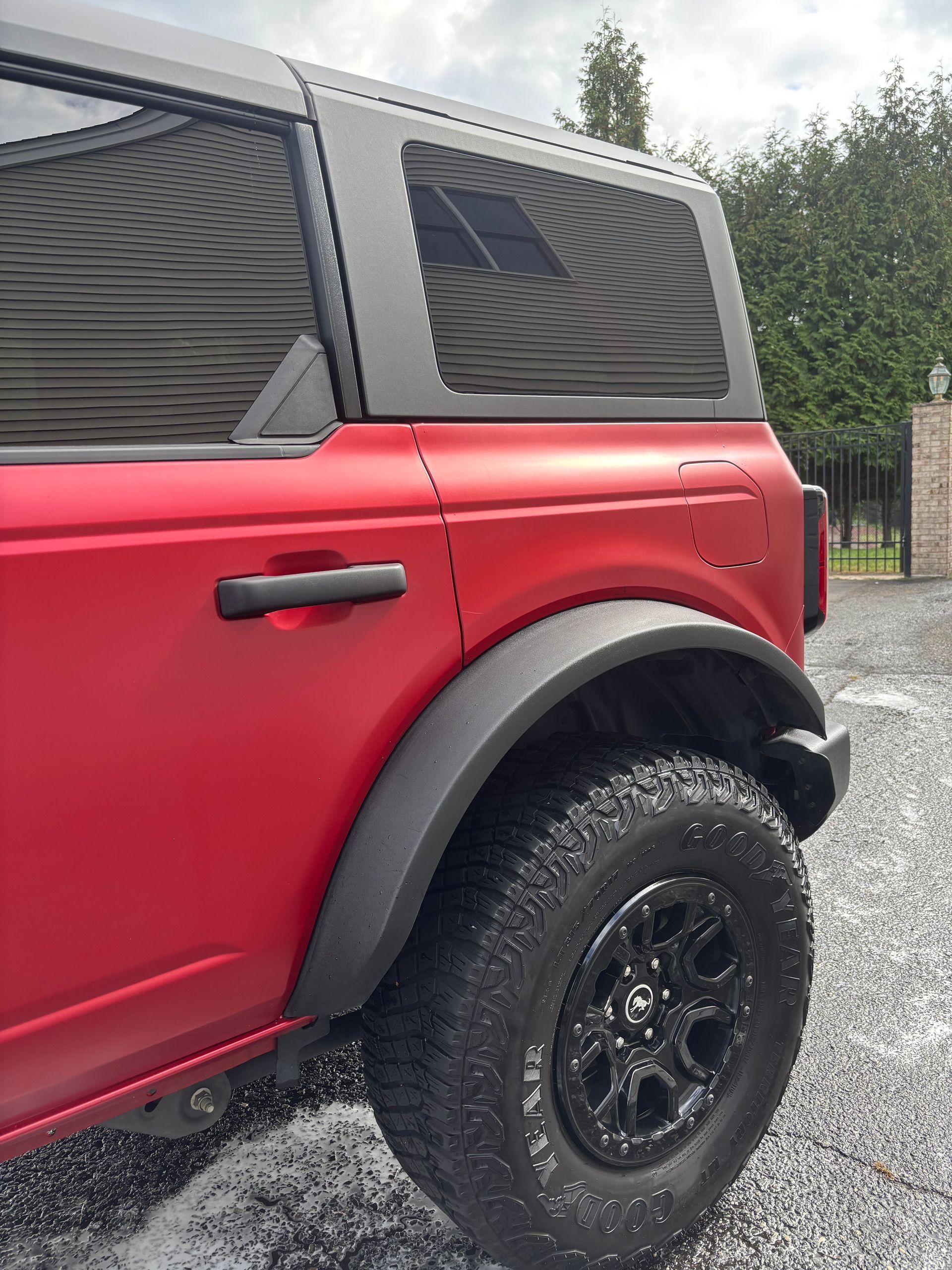 Red SUV exterior cleaned and ceramic coated for deep shine and long-lasting protection.