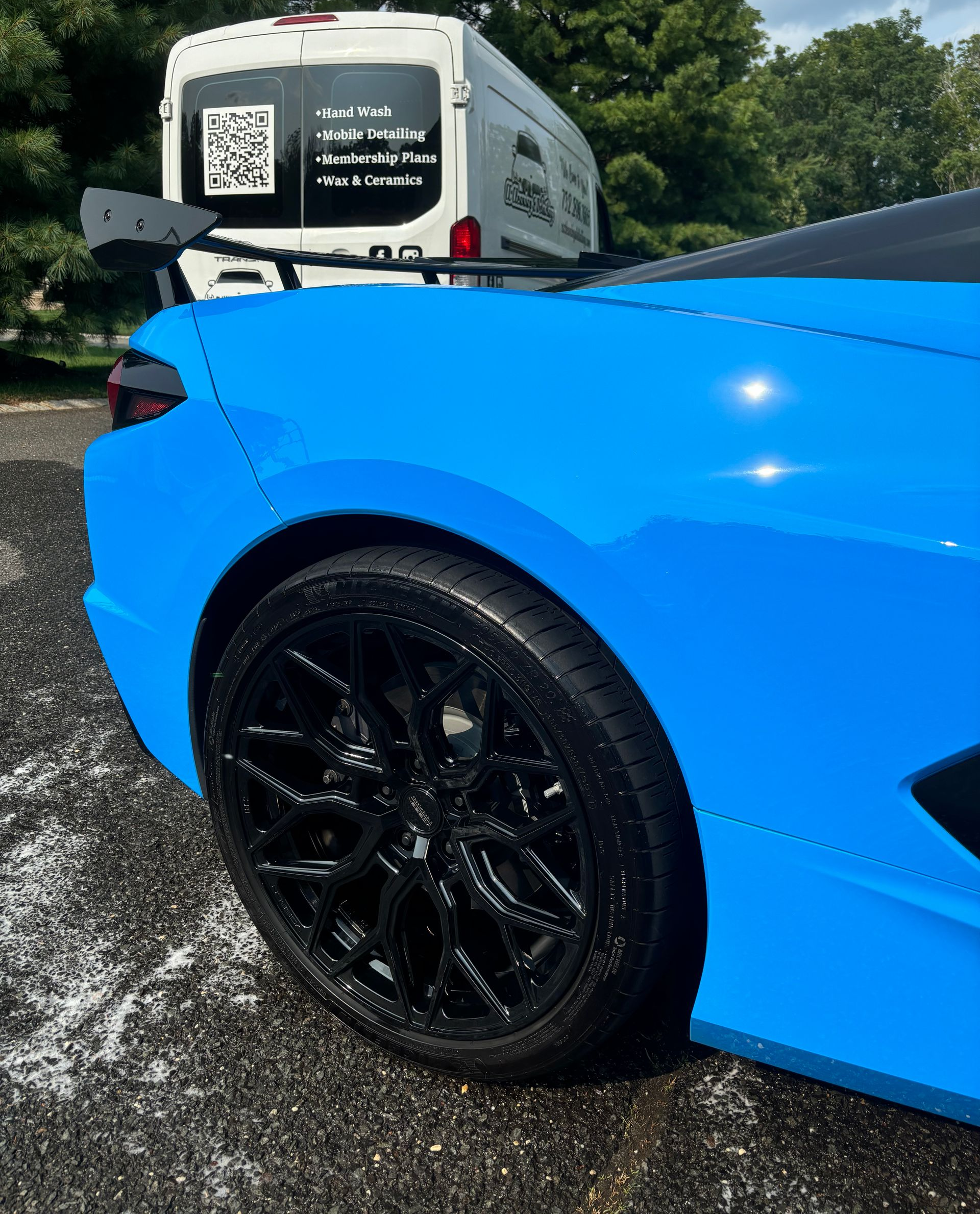 Blue Tesla Model Y exterior after ceramic coating and paint protection detailing.