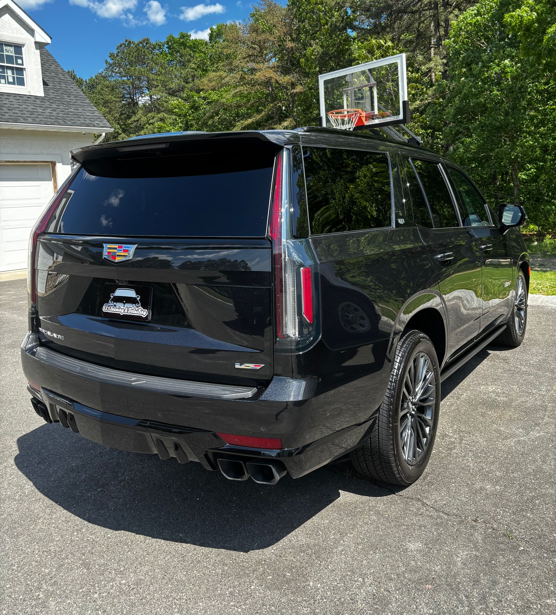 Black Cadillac Escalade showing high-gloss finish after premium detailing service