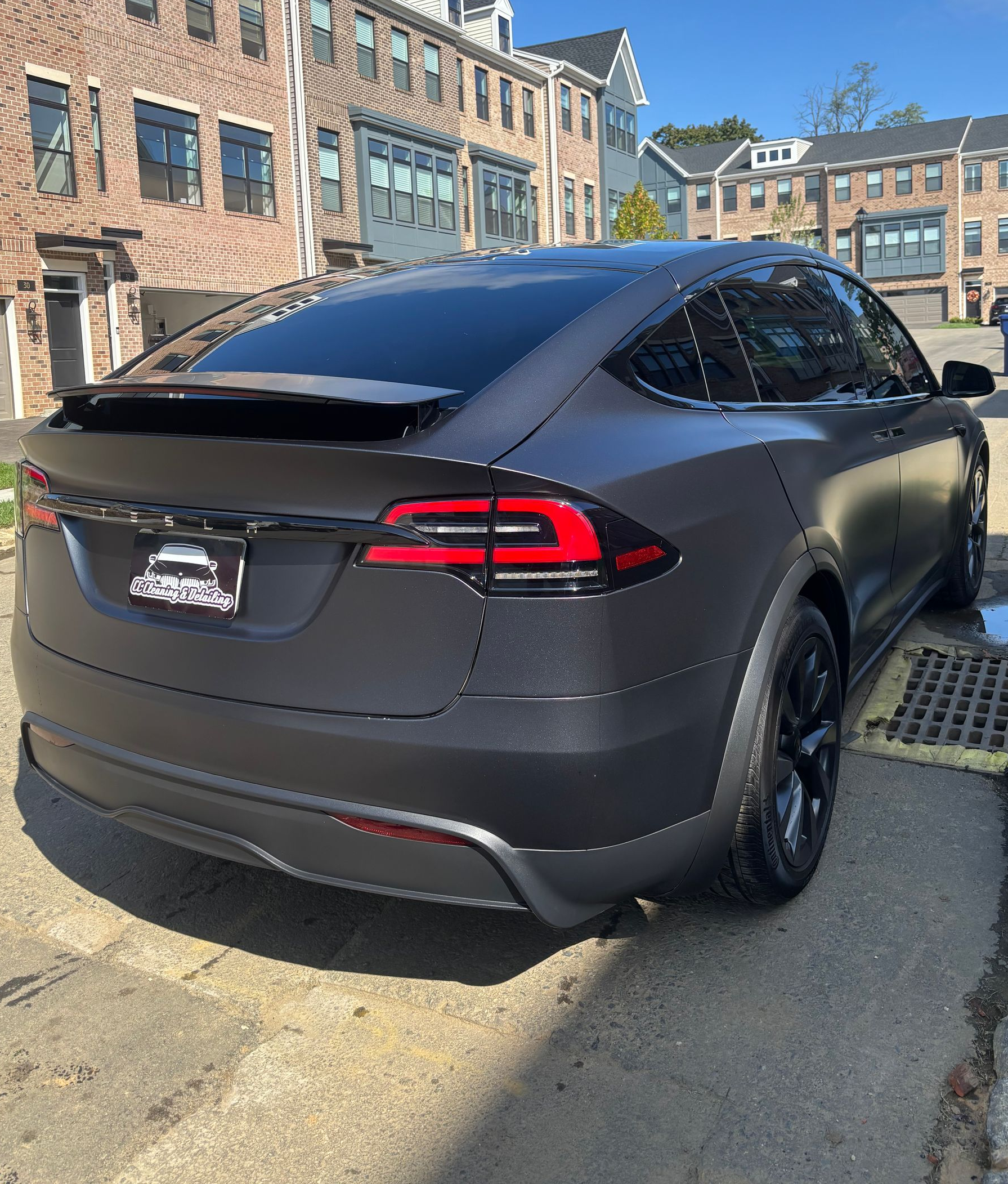 Matte black Tesla Model X after exterior detailing and premium ceramic protection service.