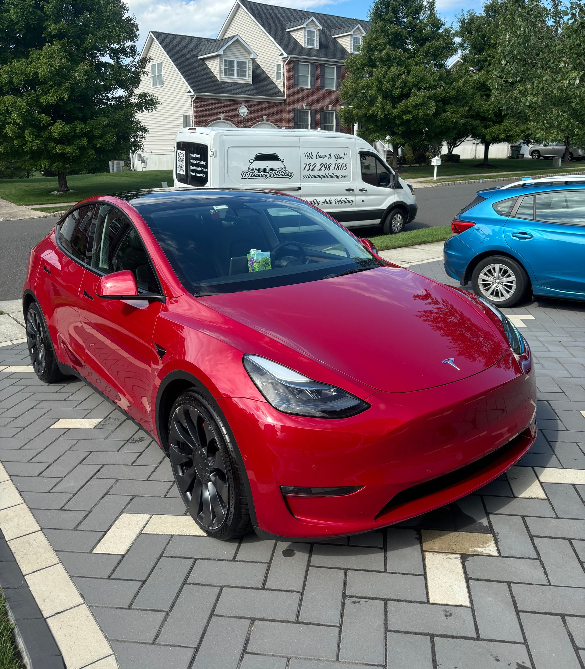 Red sports sedan freshly washed and waxed by CC Cleaning & Detailing in Middlesex County.