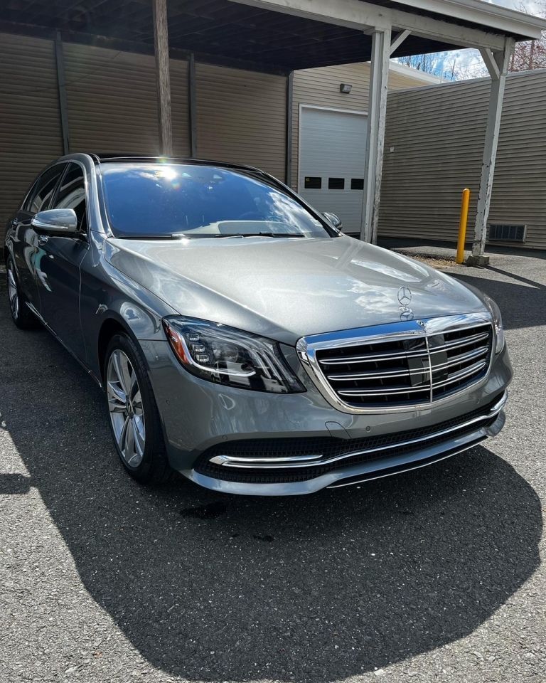 Luxury SUV parked under shade after full wash and wax by CC Cleaning & Detailing NJ.