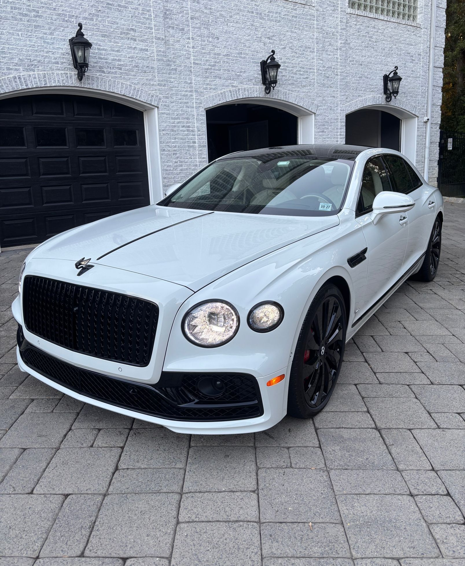 White Maserati detailed and waxed for high-gloss reflection and showroom-ready finish.