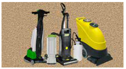 A group of vacuum cleaners sitting on top of a carpet.