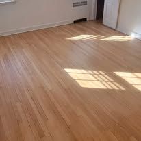Hardwood floor with sunlight shining through.