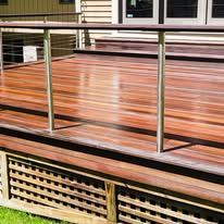 Wooden deck with stainless steel railing.