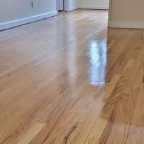 Reflective wooden hardwood floor in a room.
