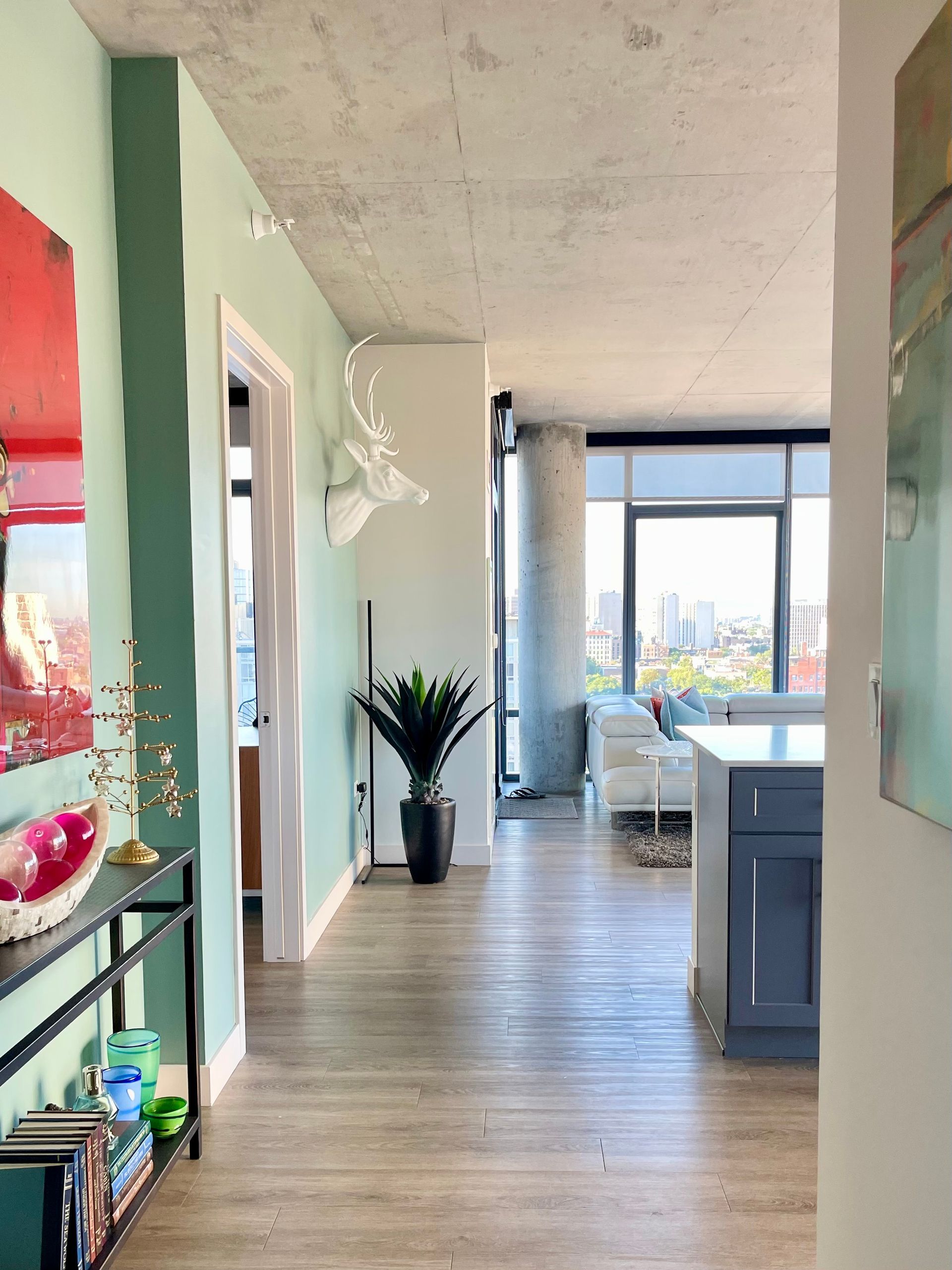 A hallway in a house with a painting on the wall