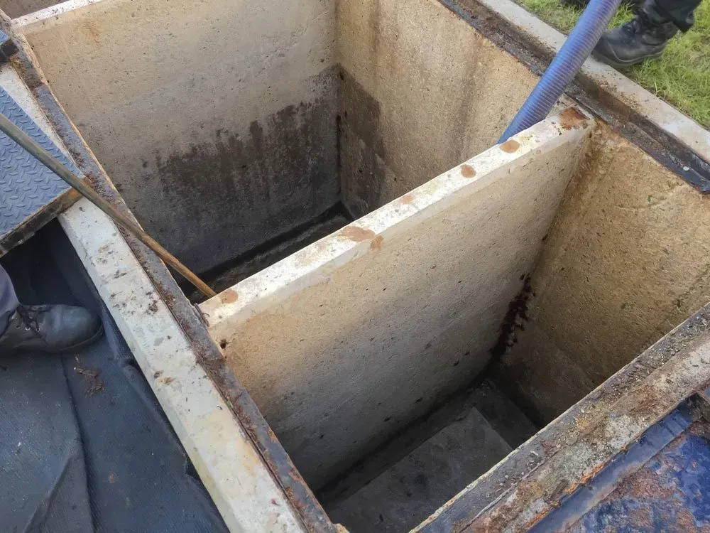 Open Concrete Rectangular Utility Box With a Divider, Being Serviced — Full On Plumbing & Gas in Winnellie, NT