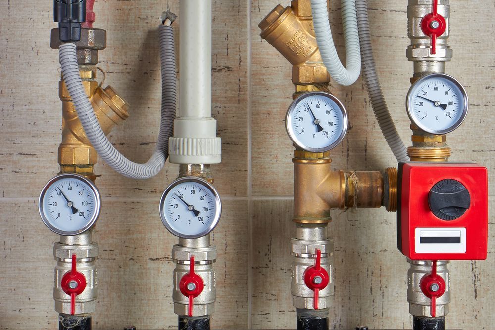 Pipes With Pressure Gauges and Valves in a Utility Room — Full On Plumbing & Gas in Winnellie, NT