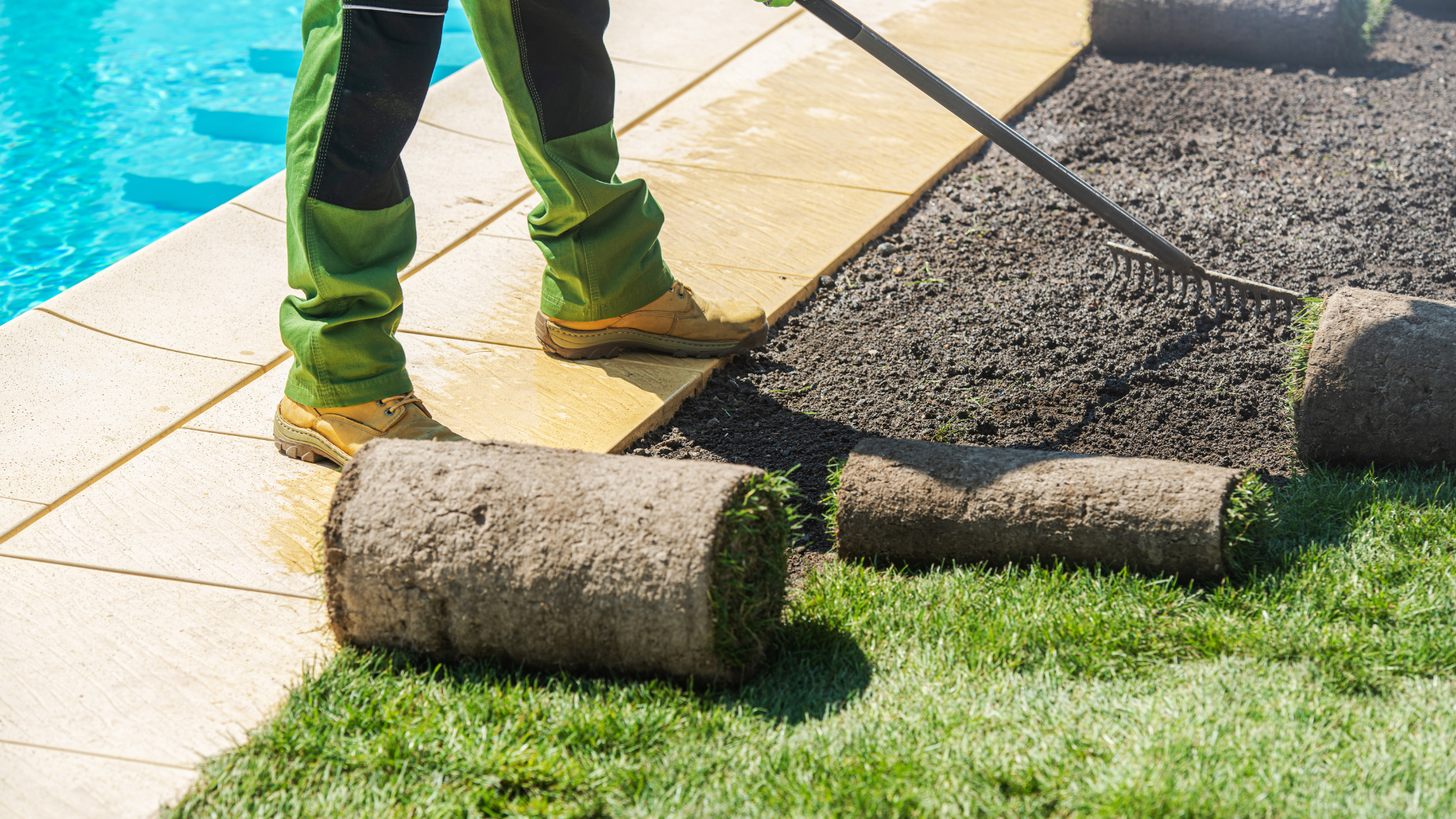 Person adjusting a smart thermostat on a wall in a home.