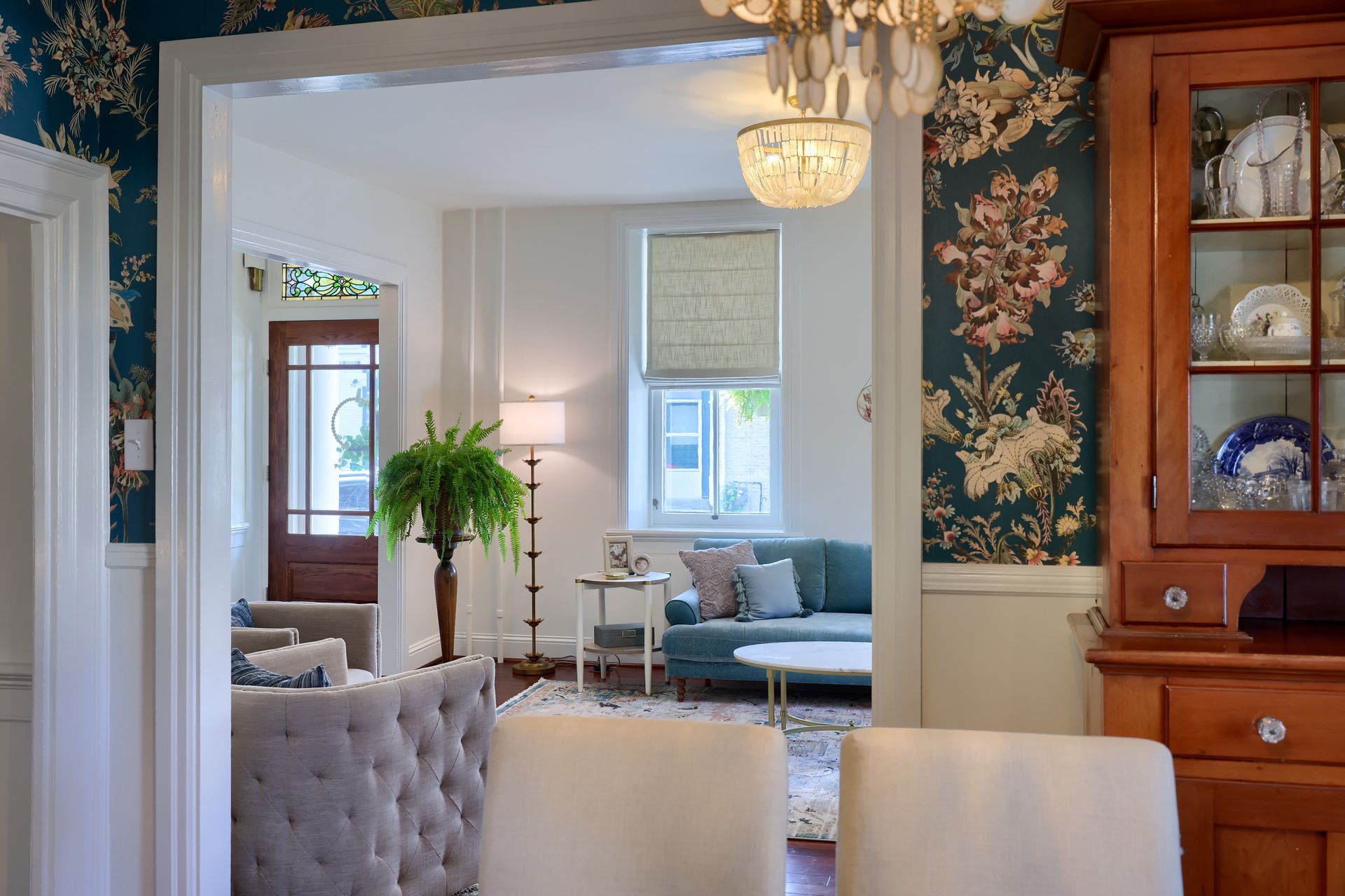 A living room and dining room are connected by a doorway.