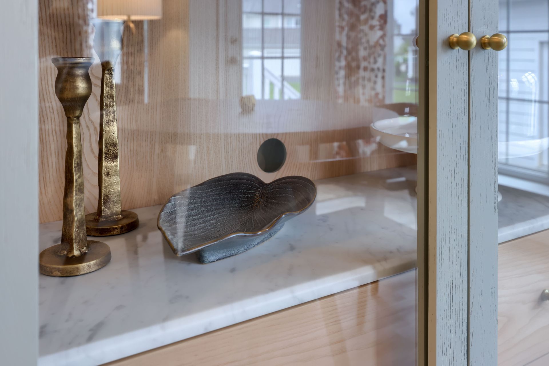 Decorative bowl and two candle holders.