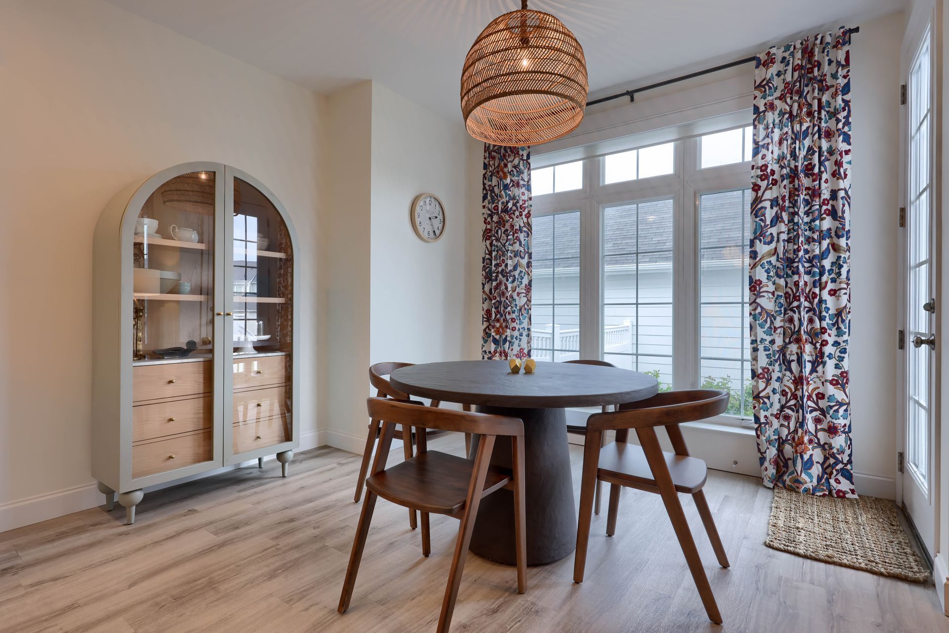 A custom dining room design with a table and chairs and custom cabinet