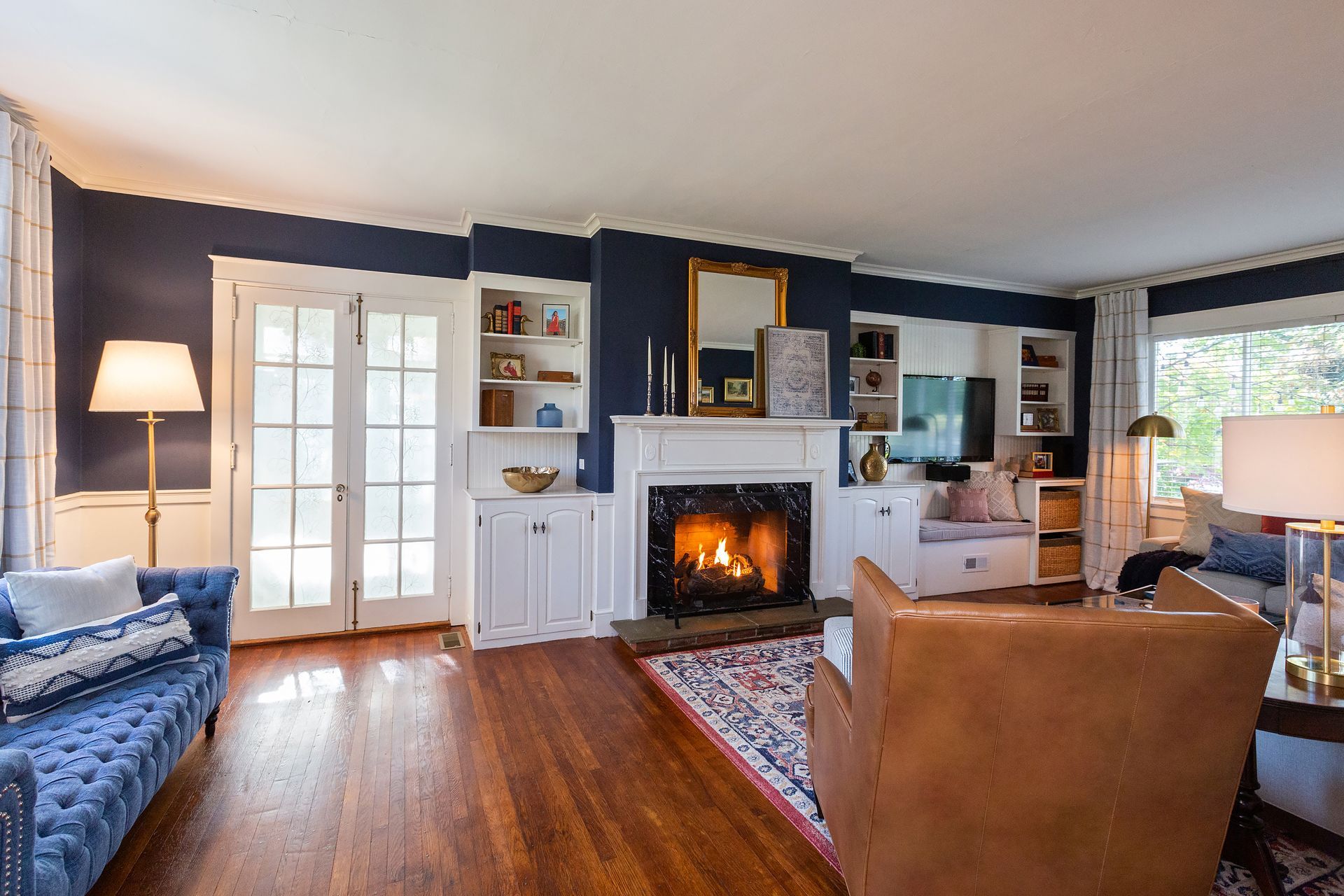 There is a fireplace in the middle of the living room.