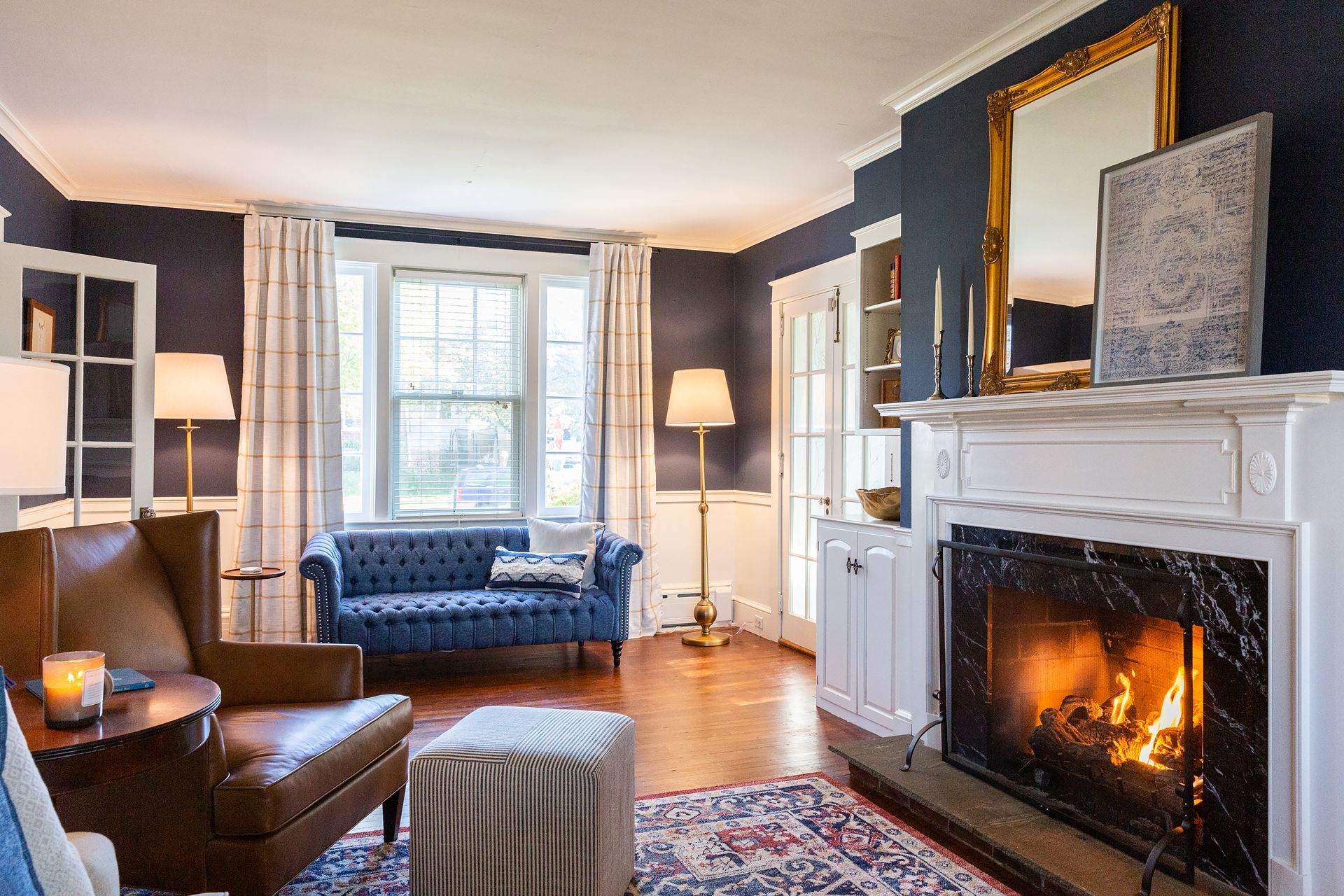 A living room with a fireplace and a couch