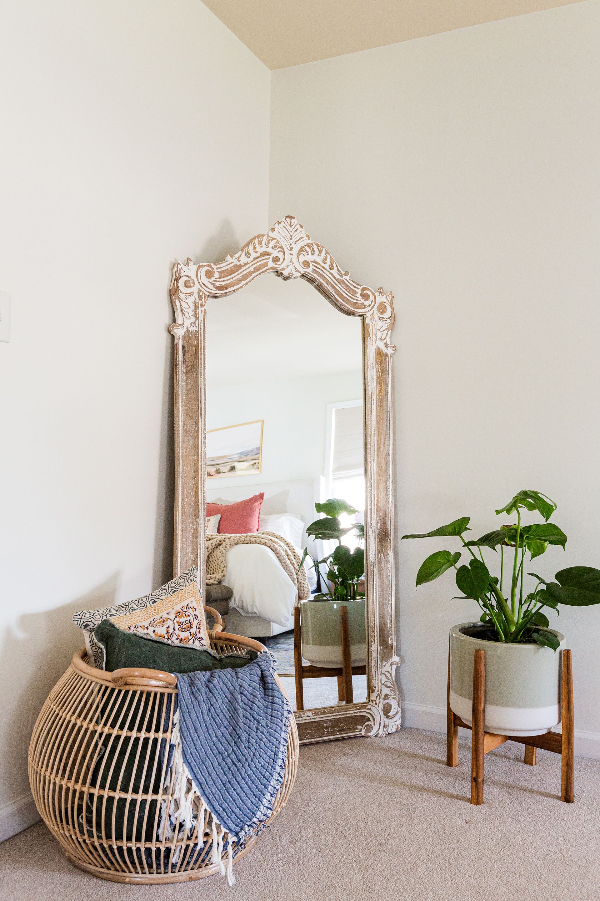 There is a large mirror in the corner of the room.