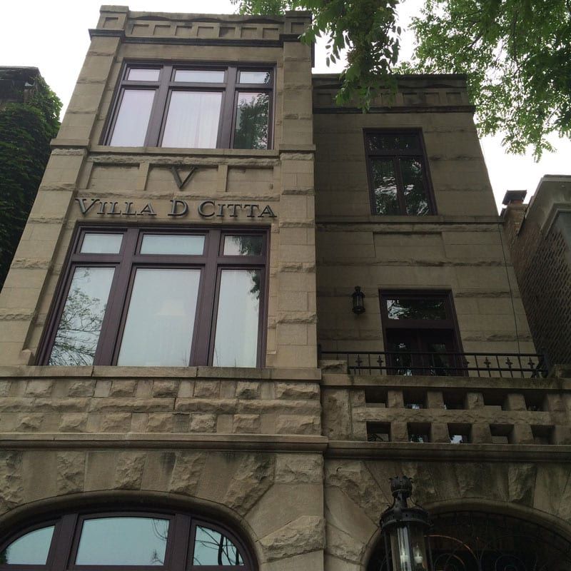 A large stone building with the name villa d citta on it