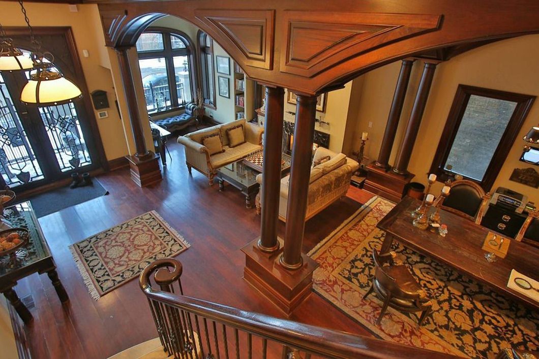 An aerial view of a living room from the stairs