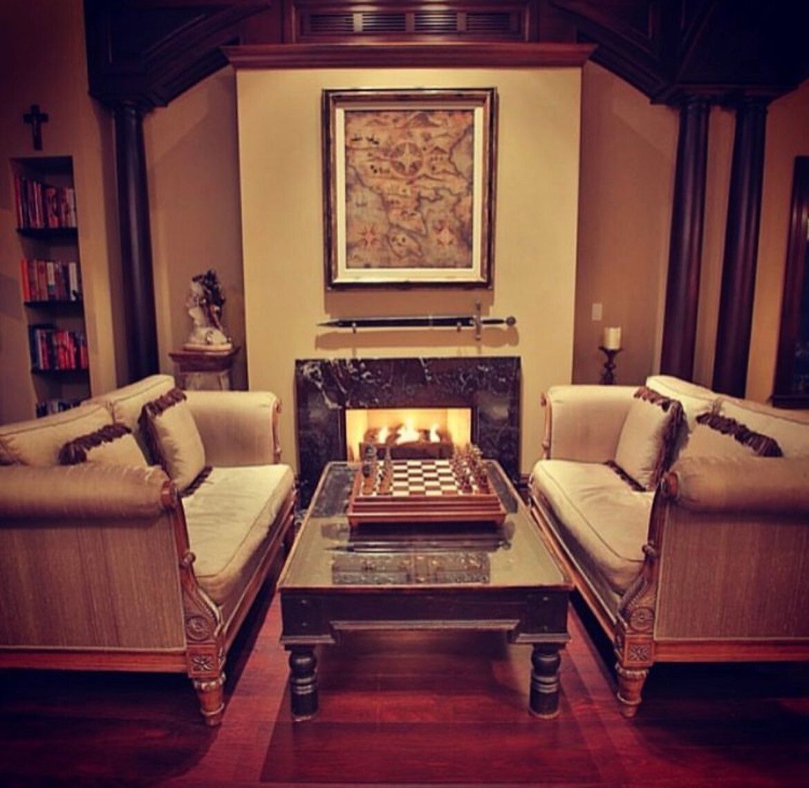 A living room with two couches a coffee table and a fireplace