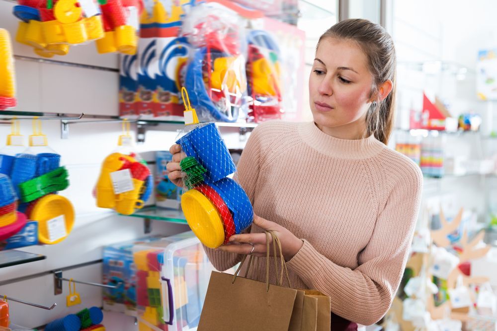 Woman Holding Children's Toy