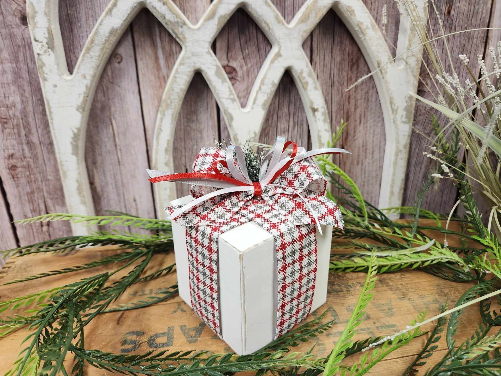 Christmas presents with white, red and grey ribbon