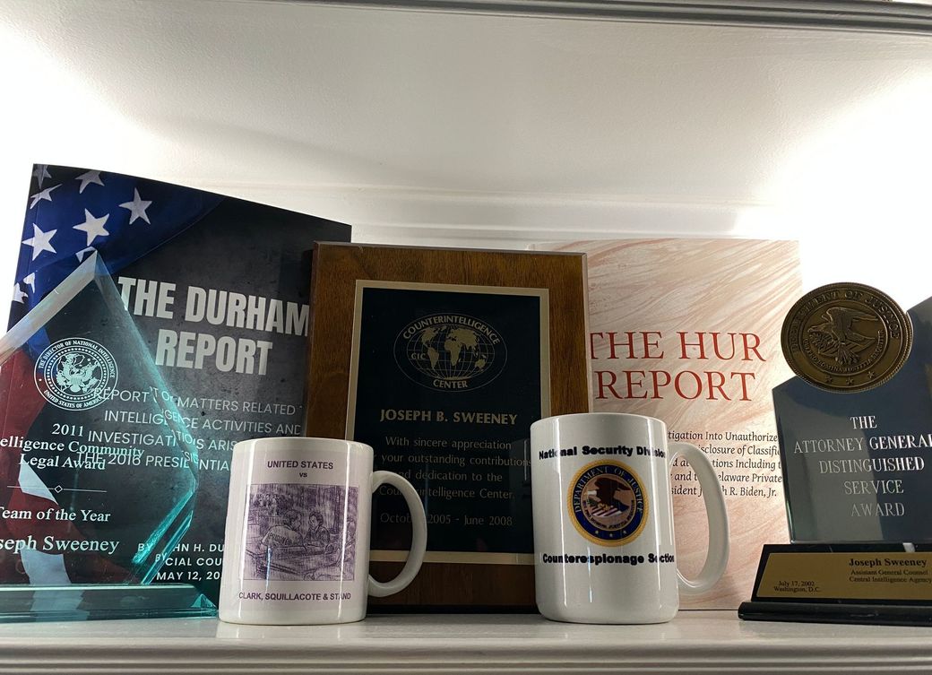 A shelf with a book titled the durham report