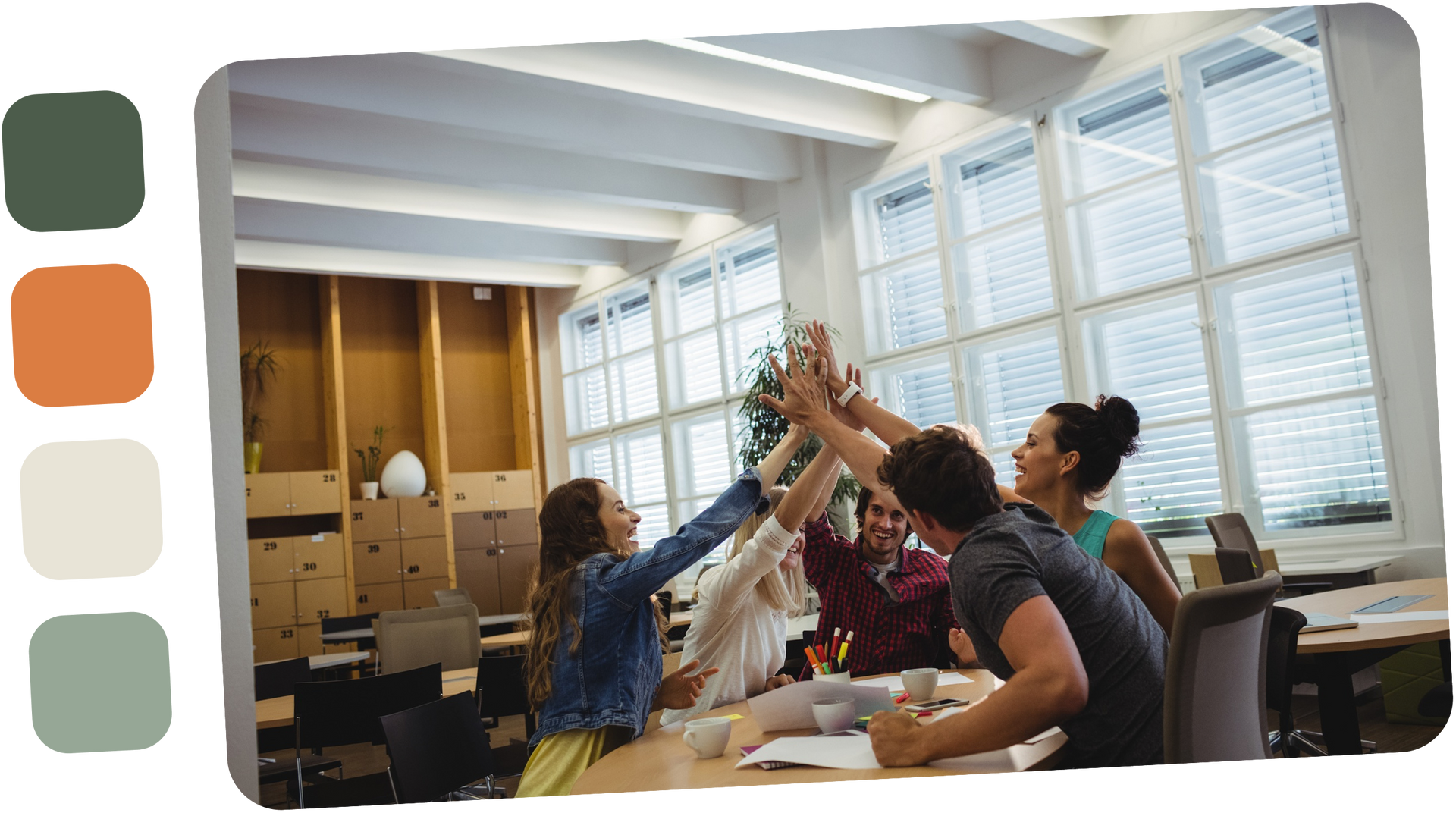 People high-fiving in office, celebrating success. Bright room with large windows, neutral tones.