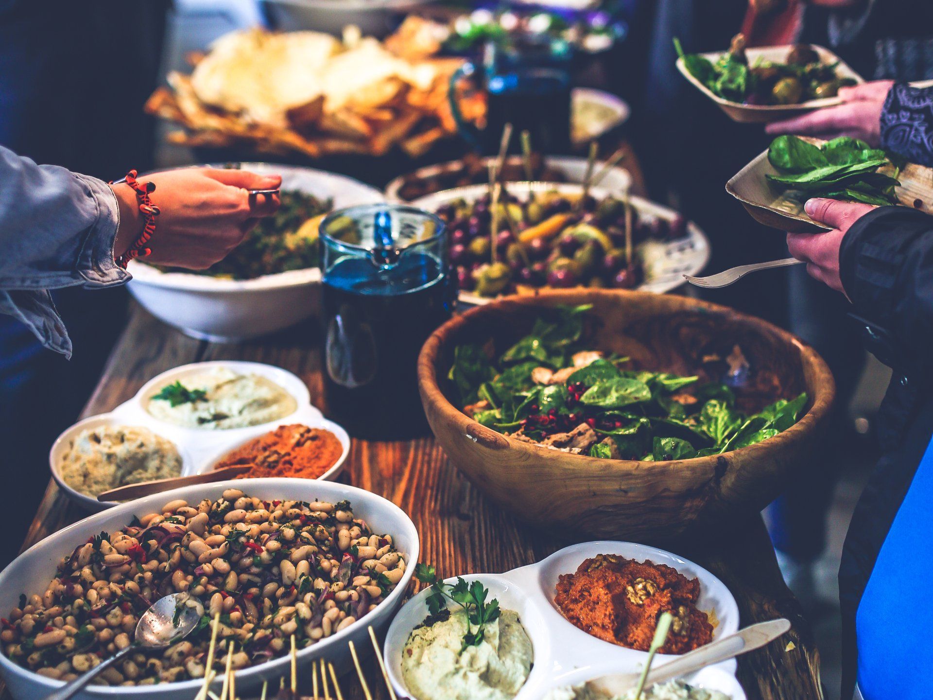 A table topped with bowls of food and plates of food.