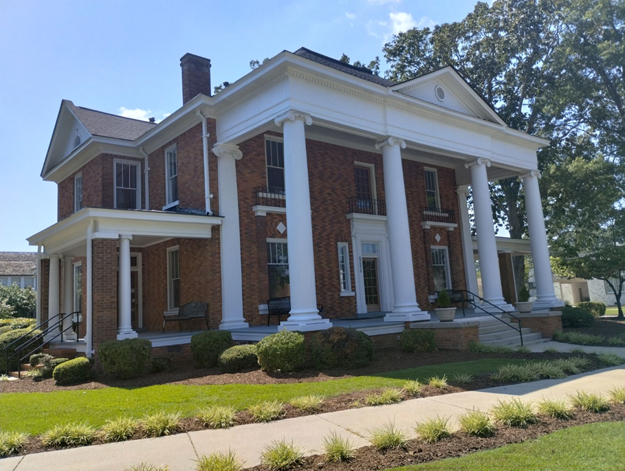 A large brick house with white columns — Raleigh, NC — Untied Painting, LLC