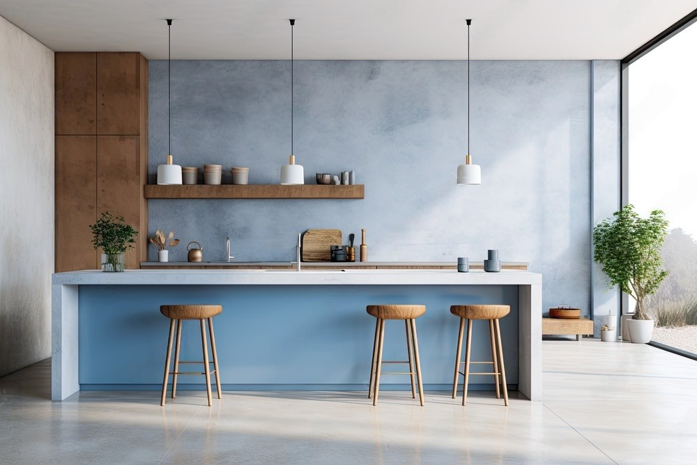 a kitchen with blue walls and wooden stools