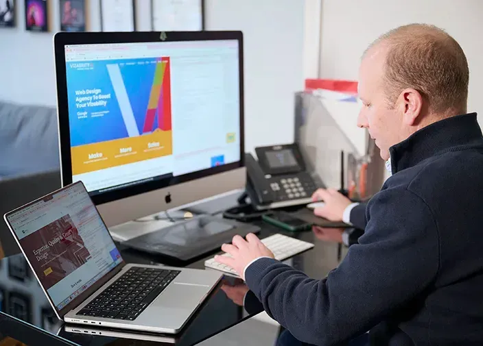 Illustration of a group of people standing around a computer monitor working on AI marketing.