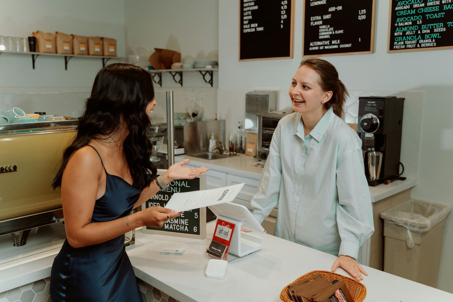 Local business, two ladies discussing web design and app development