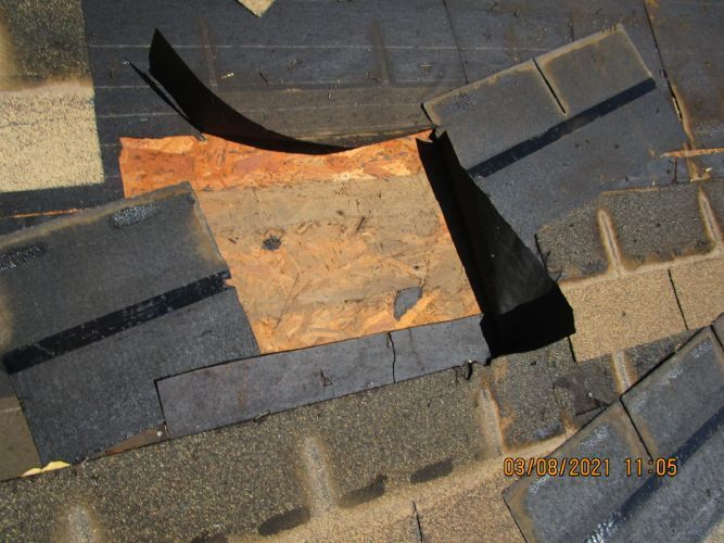 A picture of a roof with a hole in it