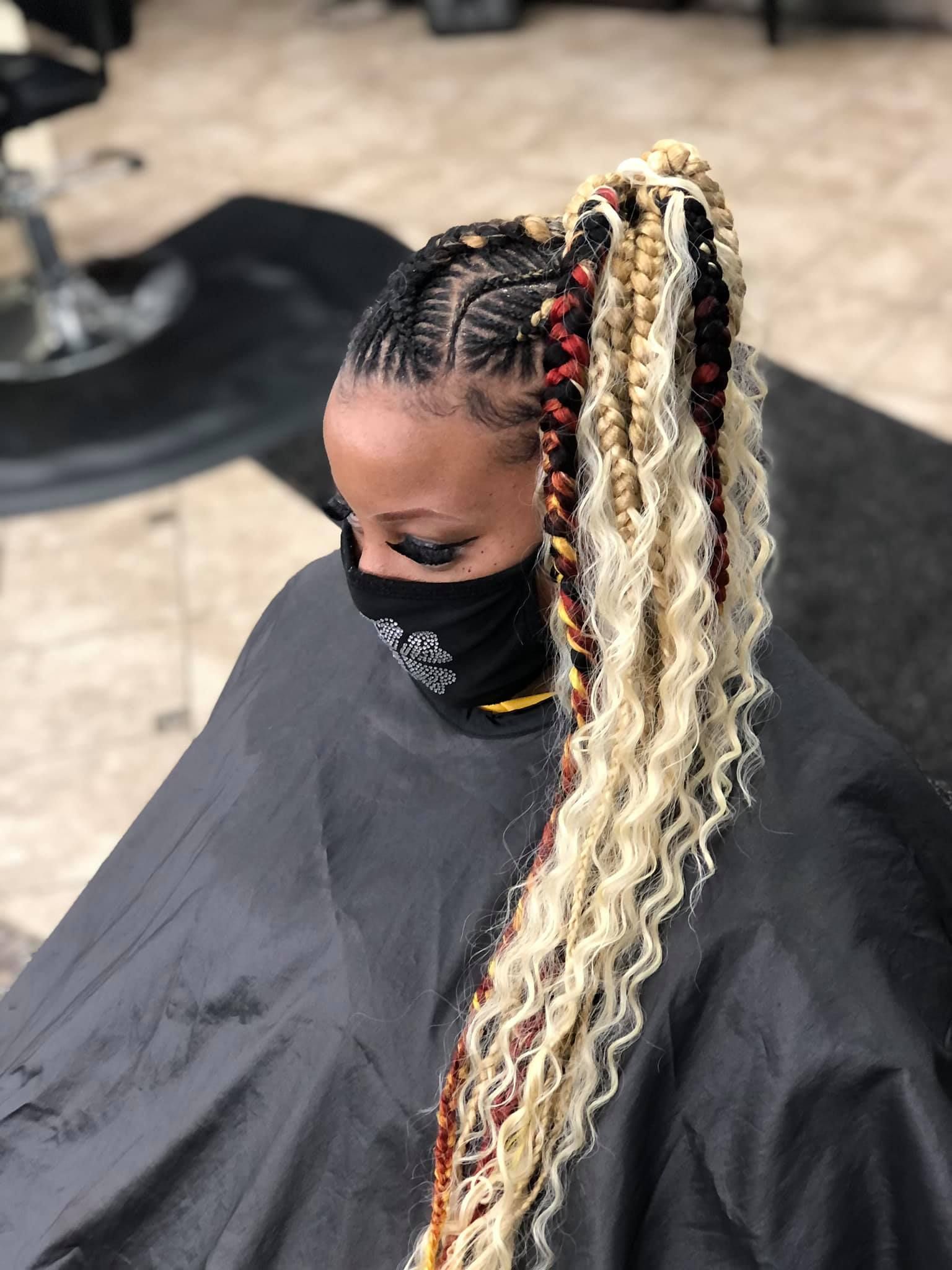 Woman with braided hairstyle.