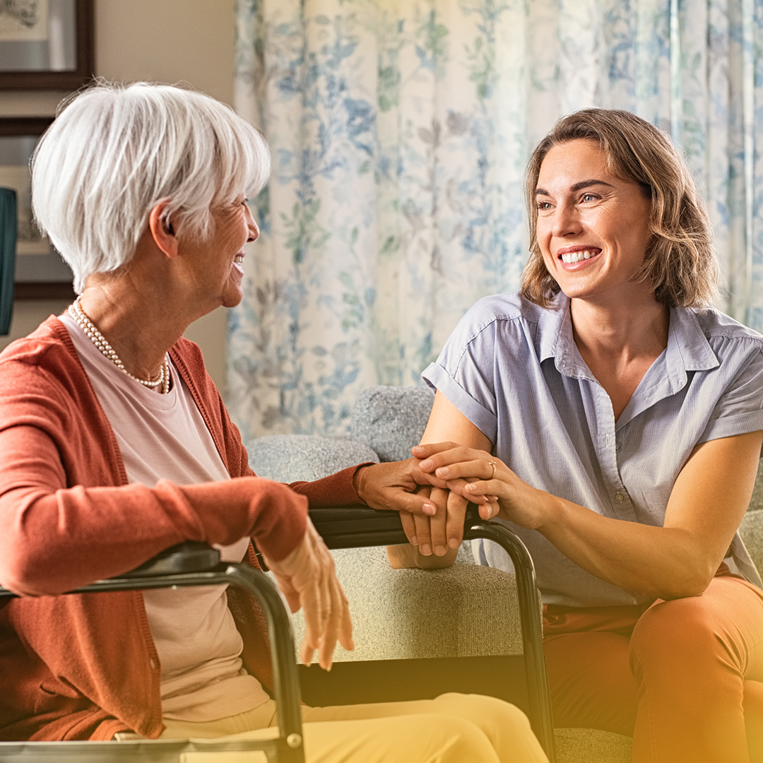 a woman reassuring an elderly lady