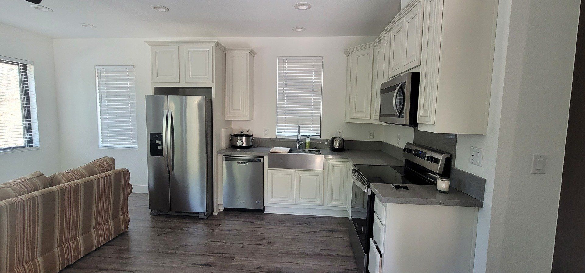 L Shaped Kitchen with Stainless Steel Appliances