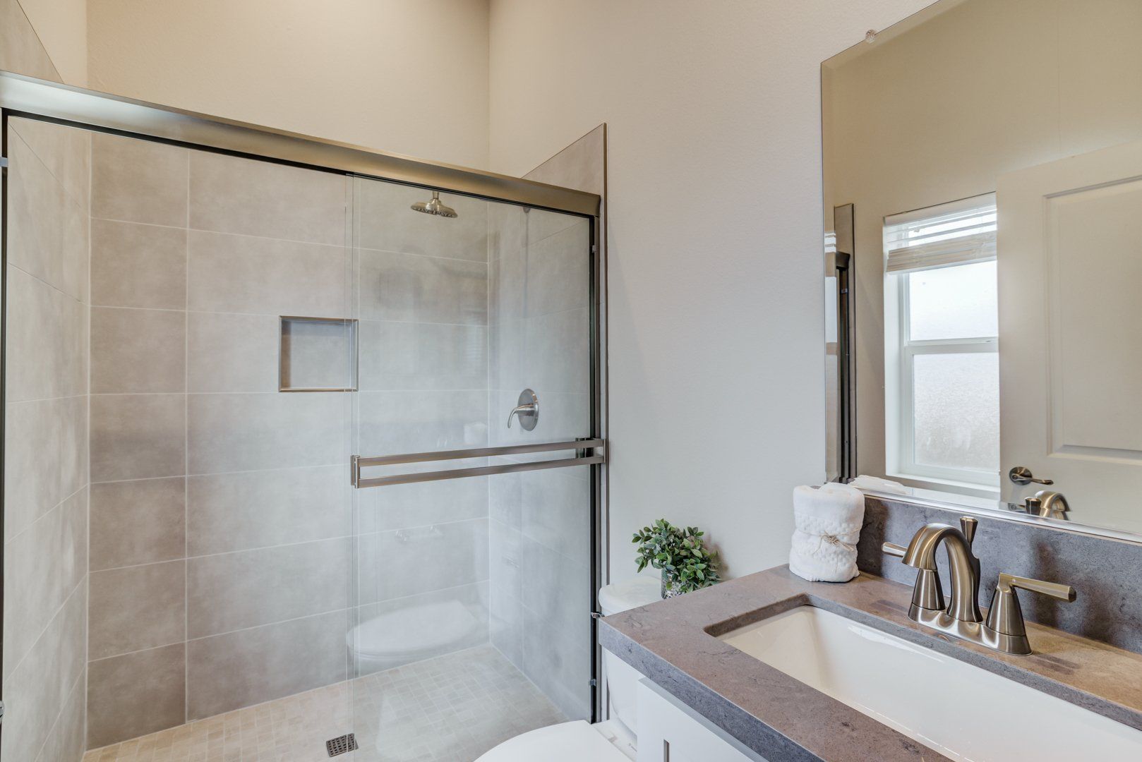 Bathroom with Tub and Shower Combo and Glass Door