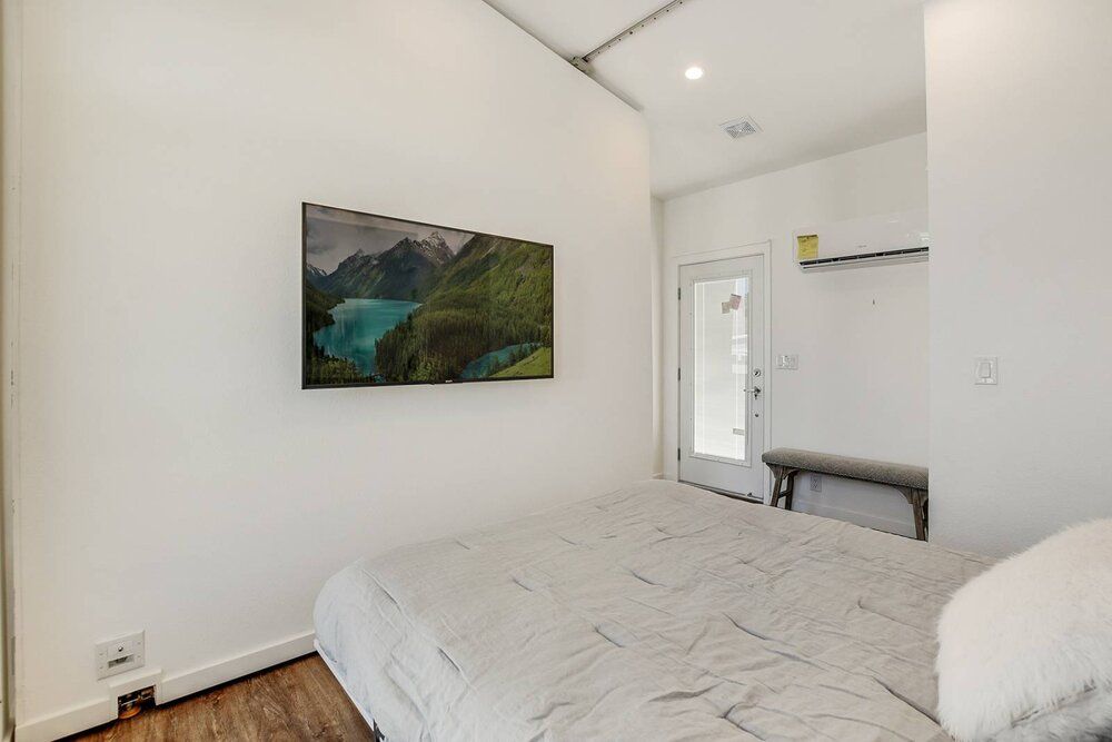 TV in Bedroom with Murphy Bed Down