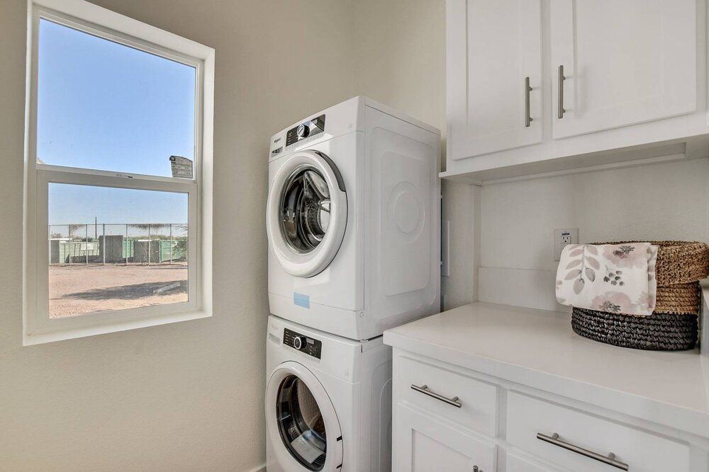 Laundry Room with Stacked Washer and Dryer