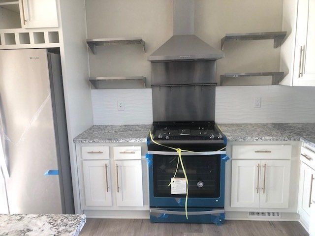 Range Hood, Range, and Granite Counter Top