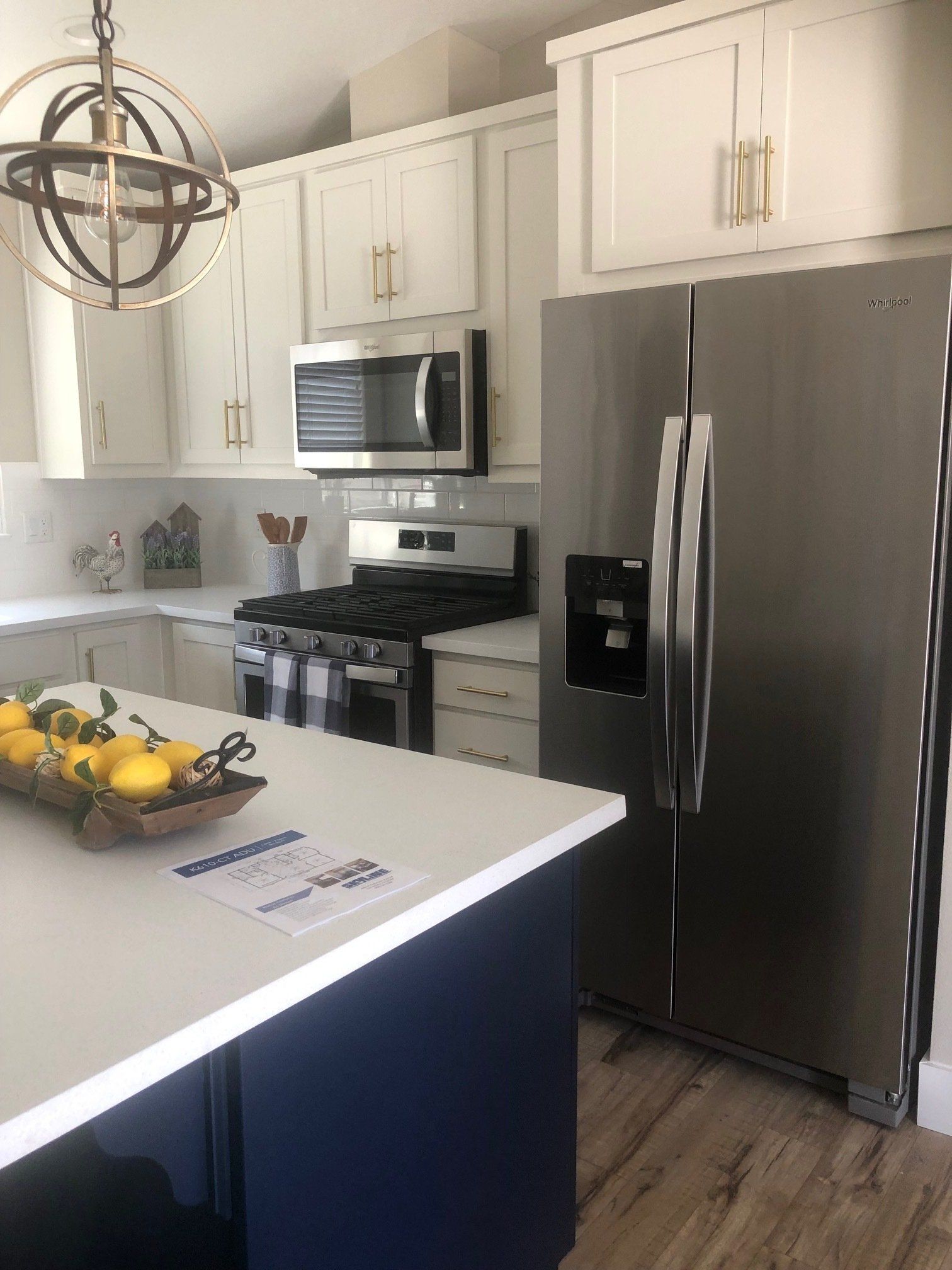 Kitchen with Stainless Steel Appliances and Pendant Lighting