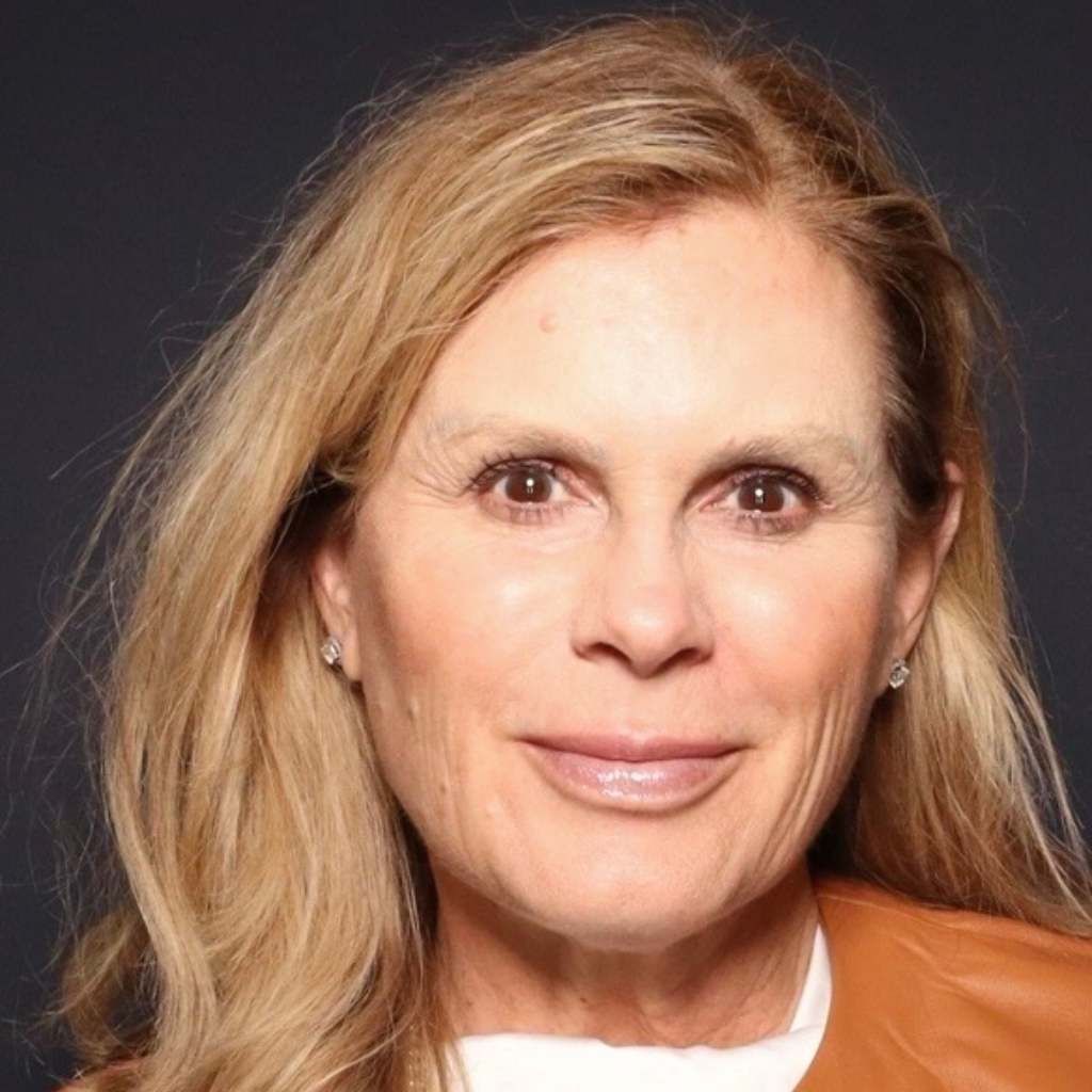 Katherine Noe Anderson, owner of Perpetual Homes ADU in Danville, CA. Has blonde hair, wearing a white top and brown jacket.