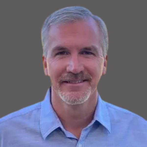 Mark Landolf of Perpetual Homes ADU. A man with gray hair and beard, smiling, wearing a light blue button-down shirt.