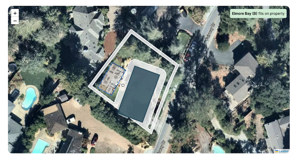 Perpetual Homes ADU: Modern kitchen with white cabinets, stainless steel appliances, and an open living concept.