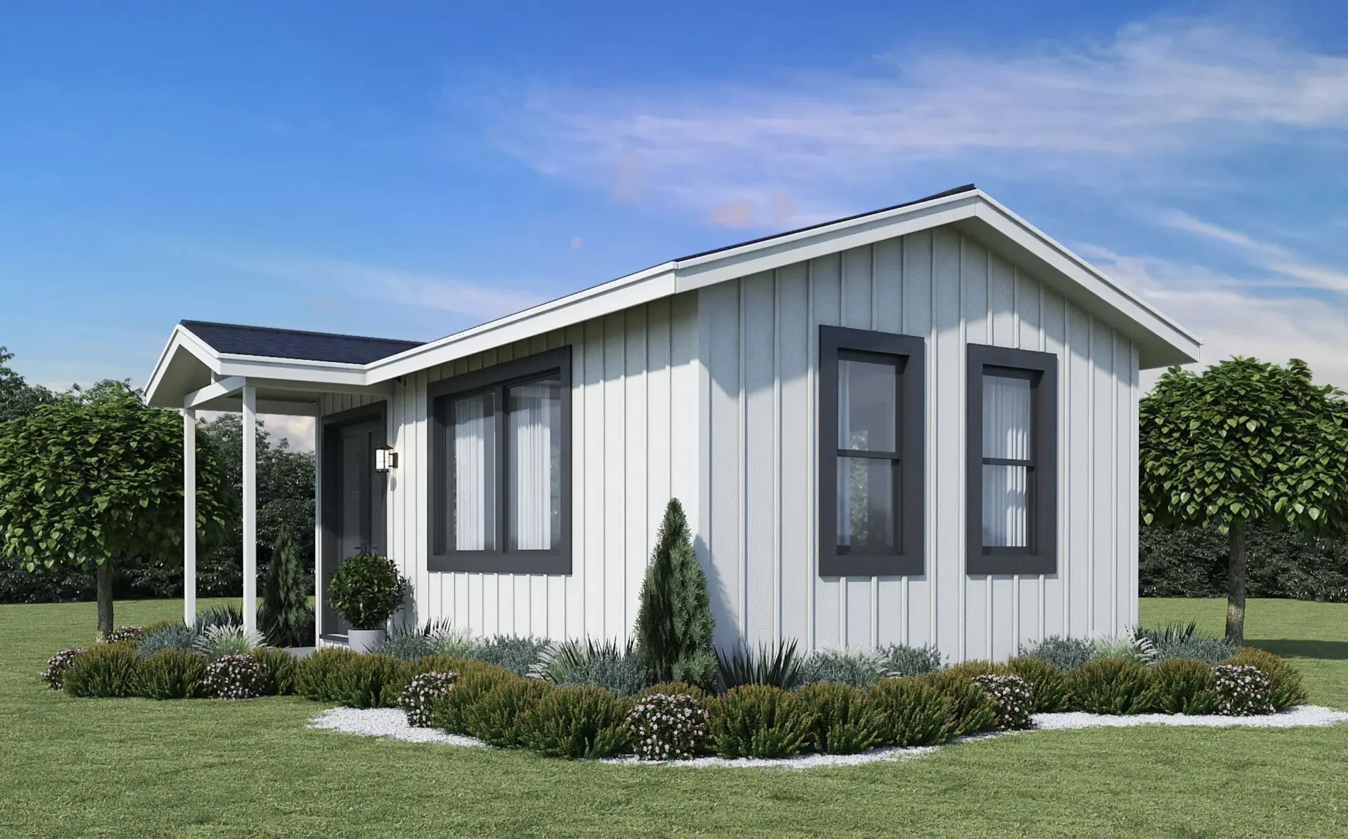 Modern white tiny home with black trim, outdoor patio with wicker furniture.