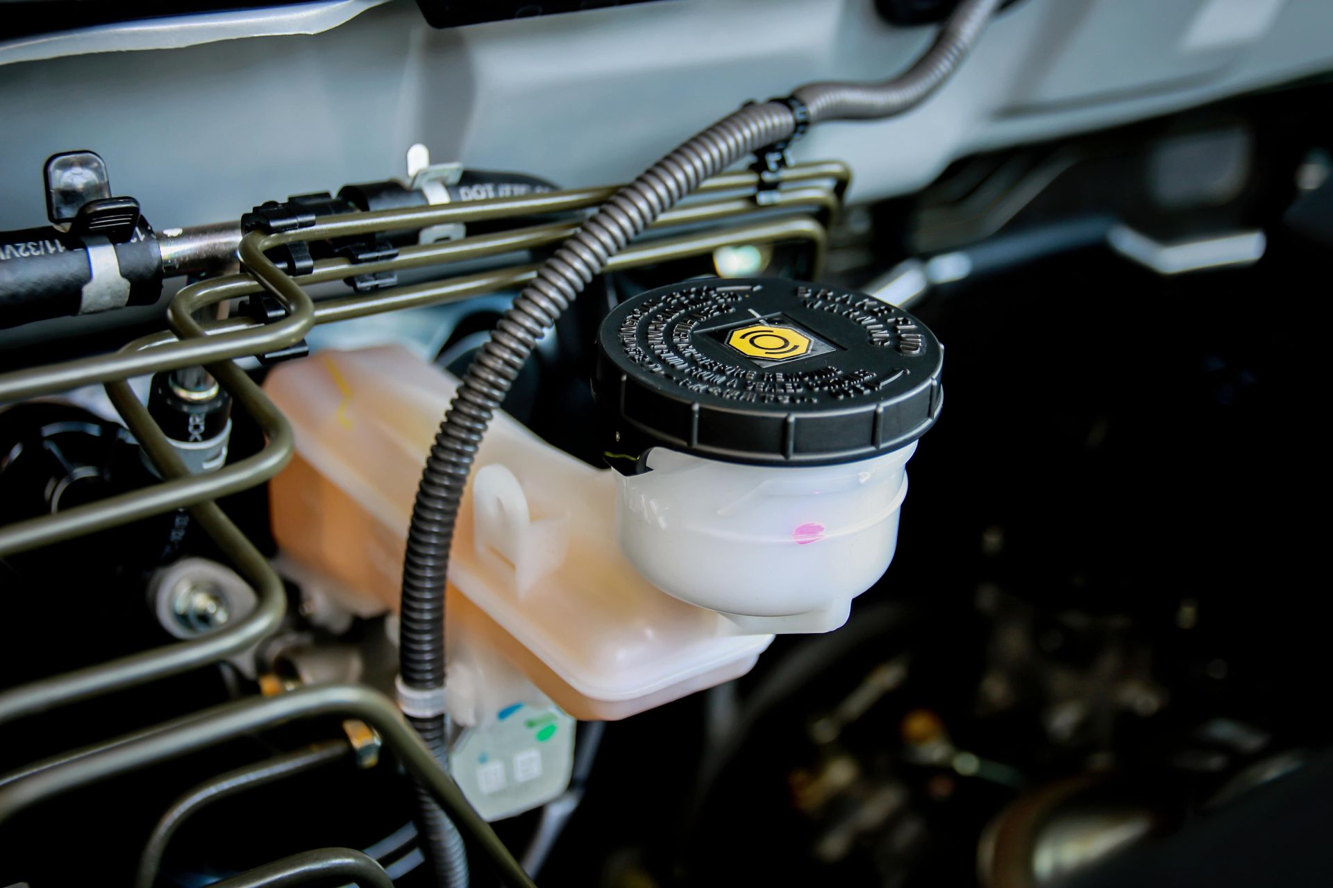 Under the hood of a vehicle at Car Aid