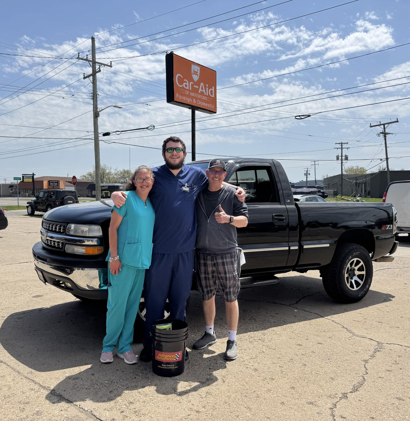 A man is working under the hood of an audi q5.