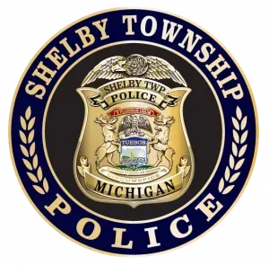 A shelby township michigan police badge on a white background